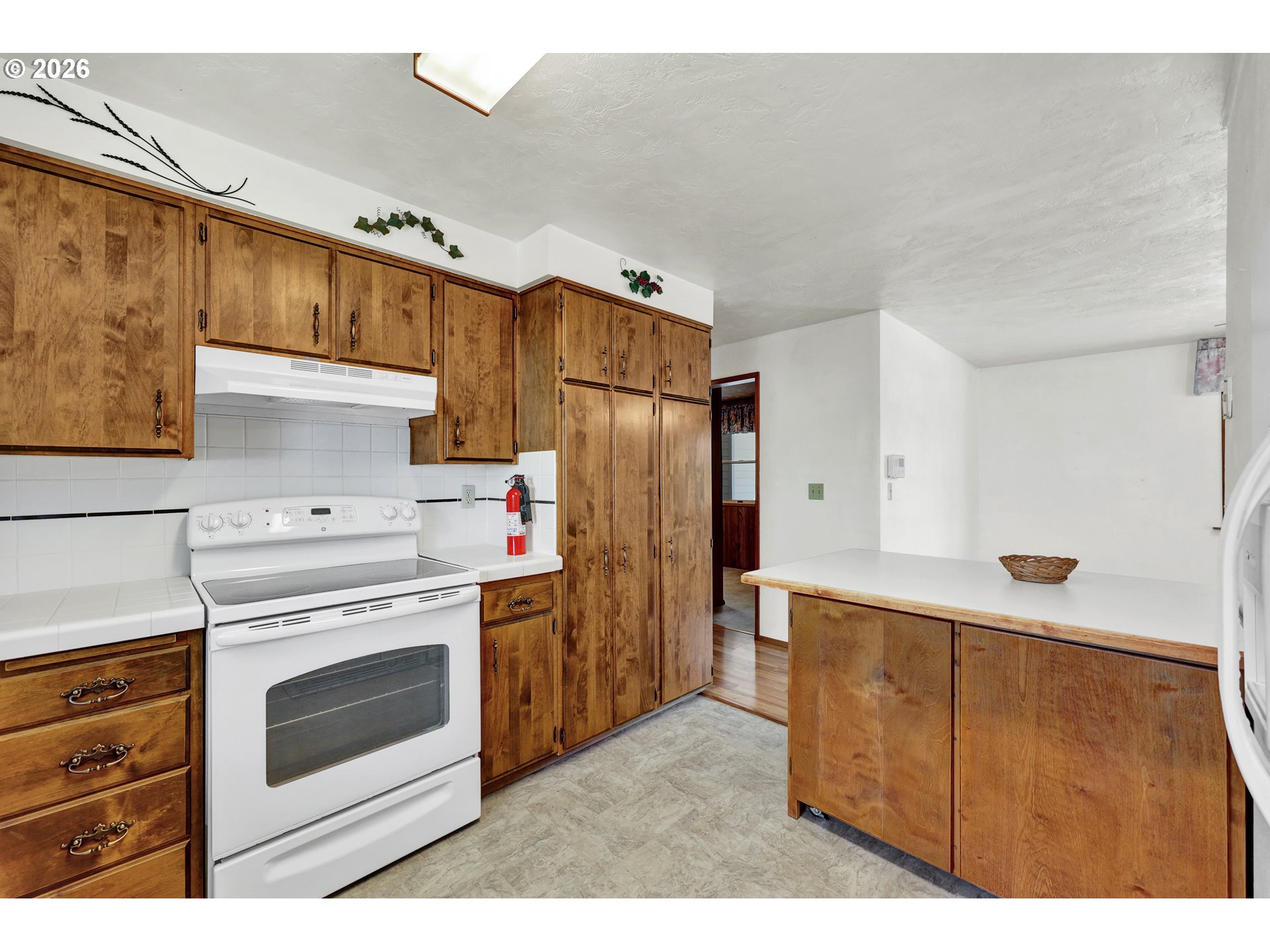 1425 Taney Street Eugene, OR 97402 - Photo 13 of 34 a kitchen with cabinets stainless steel appliances and a counter space