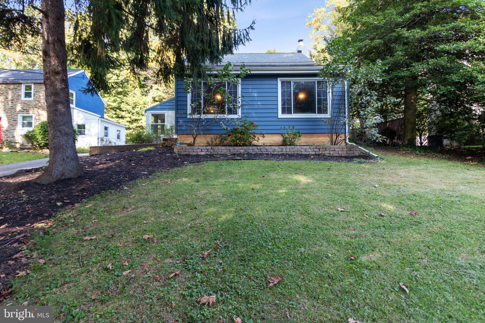 1217 Providence Road Springfield, PA 19064 - Photo 2 of 41 a front view of a house with garden