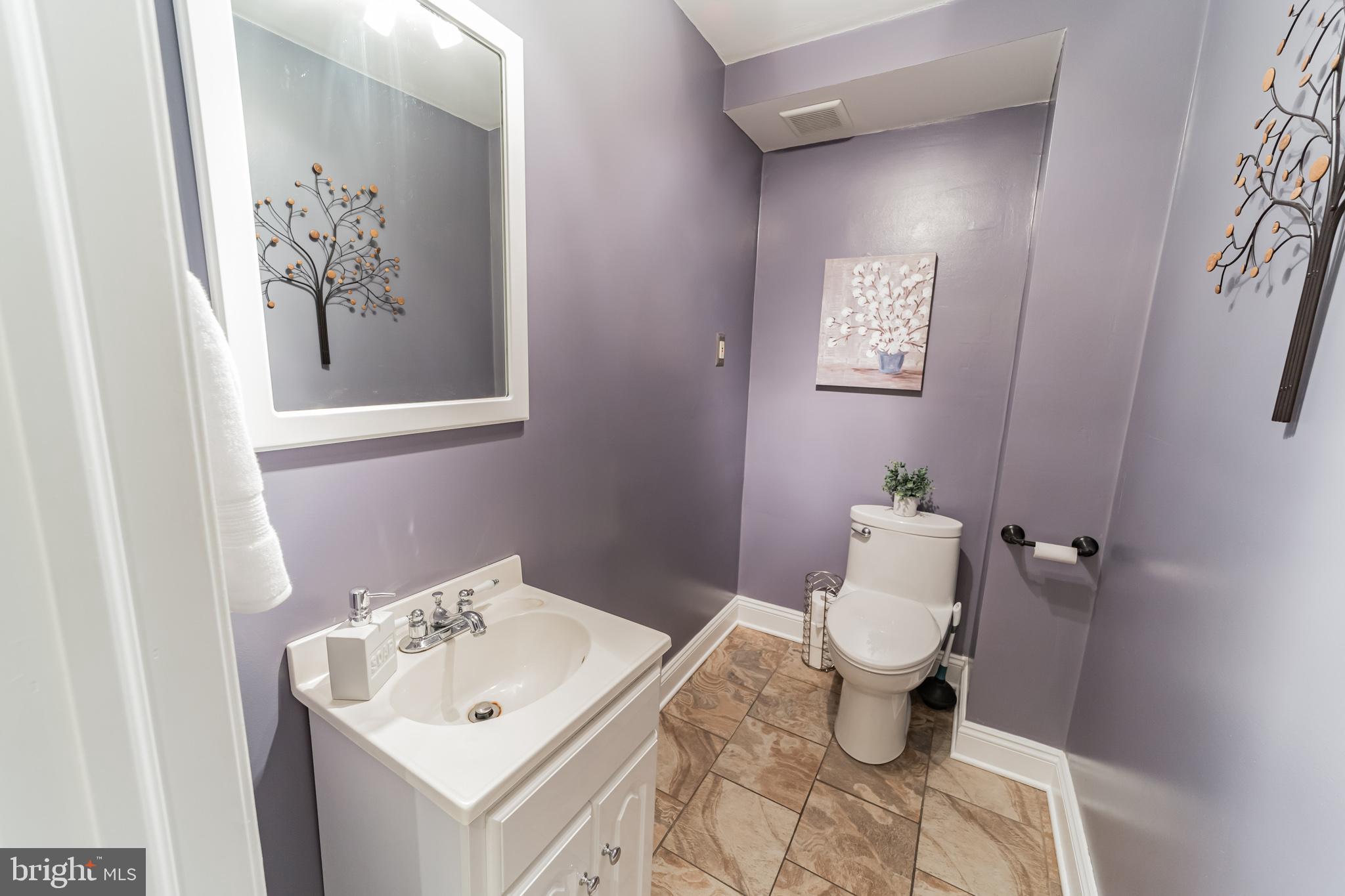 1217 Providence Road Springfield, PA 19064 - Photo 20 of 41 a bathroom with a toilet sink and mirror