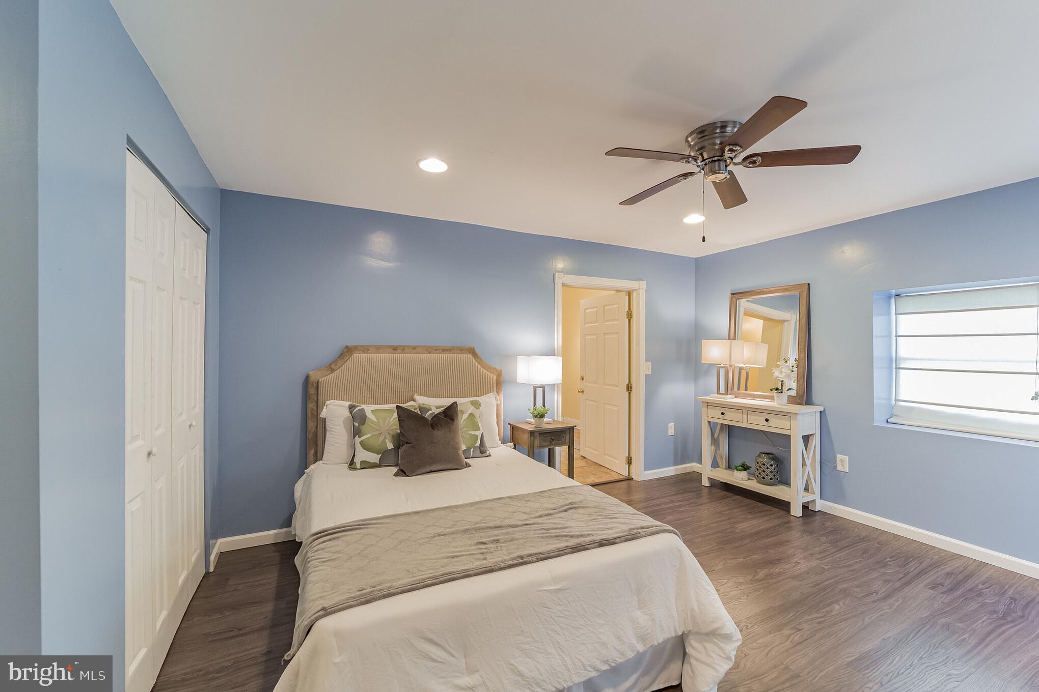 1217 Providence Road Springfield, PA 19064 - Photo 25 of 41 a bedroom with a bed and a chandelier