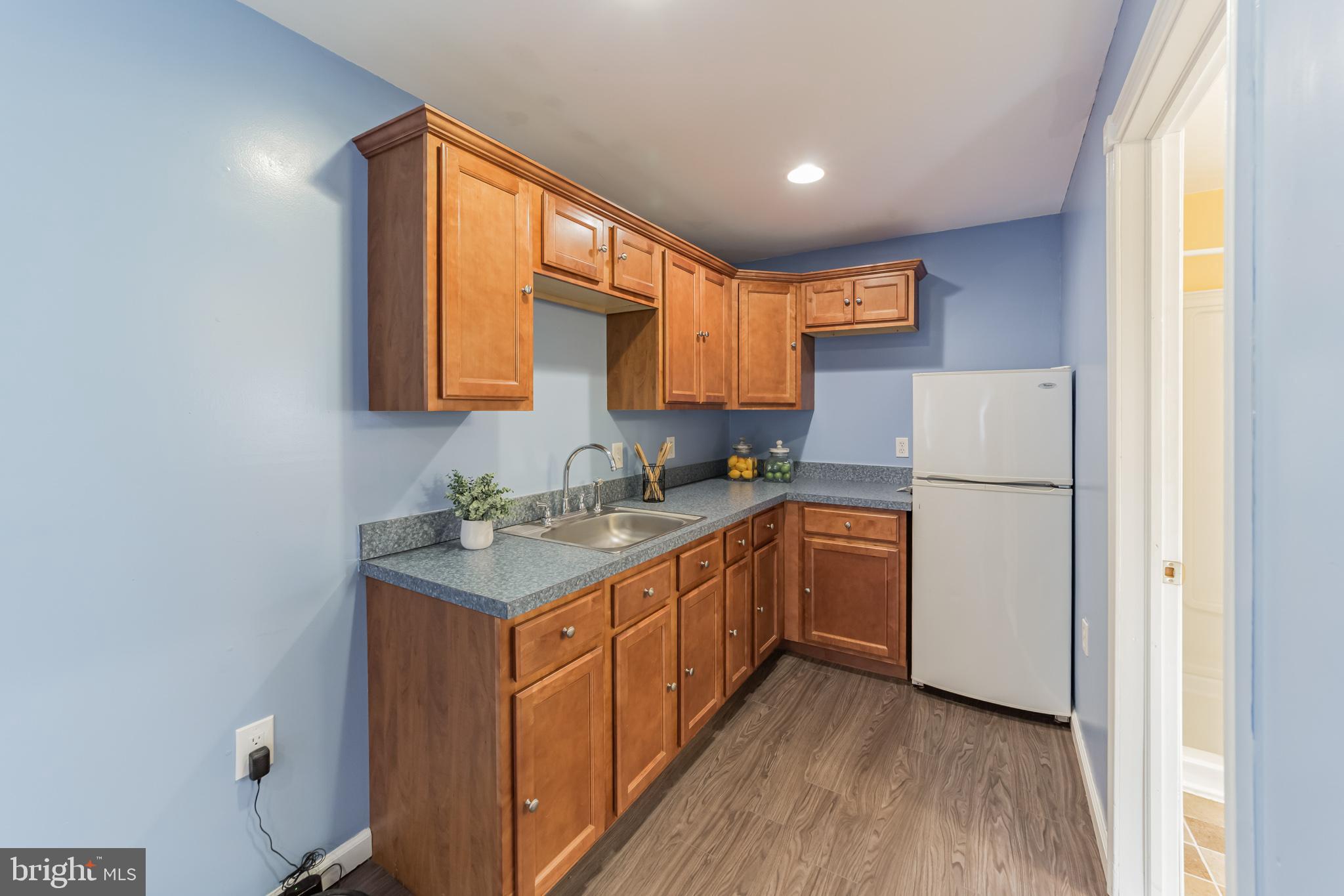 1217 Providence Road Springfield, PA 19064 - Photo 26 of 41 a kitchen with a refrigerator sink and cabinets