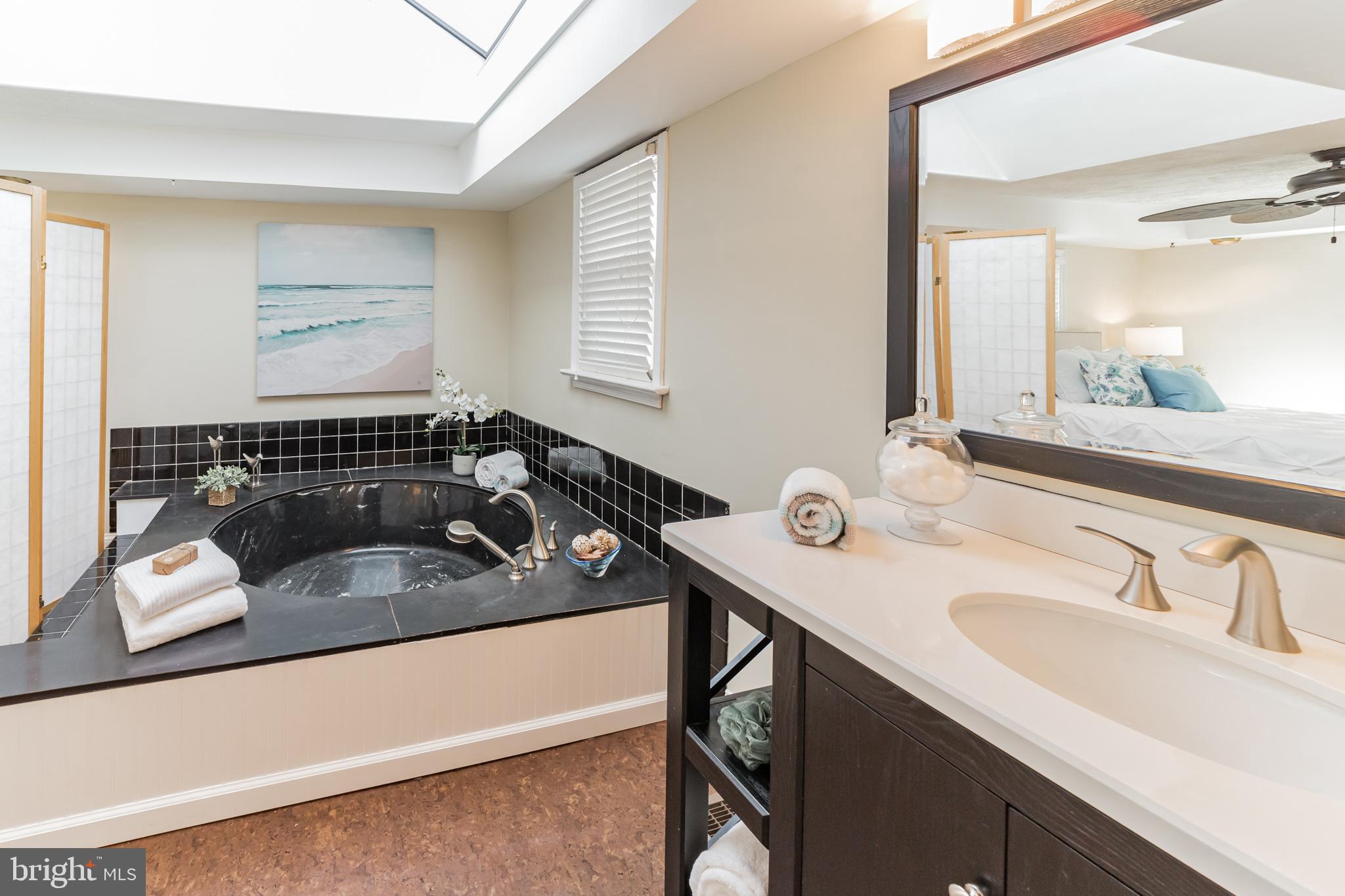 1217 Providence Road Springfield, PA 19064 - Photo 29 of 41 a bathroom with a sink and a mirror