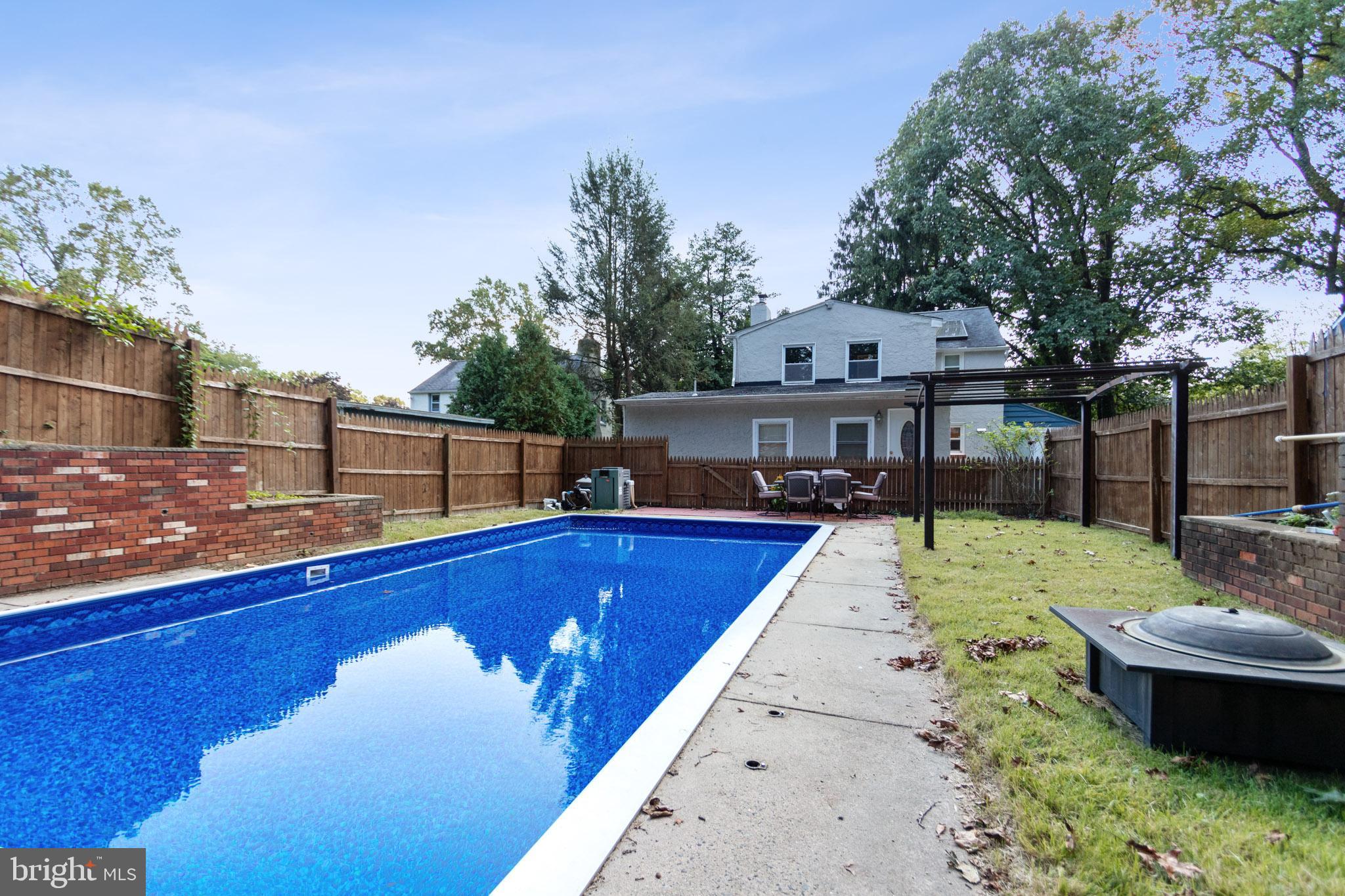 1217 Providence Road Springfield, PA 19064 - Photo 39 of 41 a view of a swimming pool with a patio