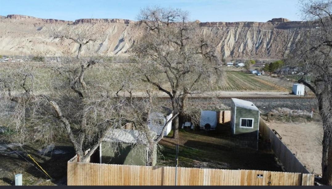 3670 G Road Palisade, CO 81526 - Photo 8 of 11 a view of a house with a yard