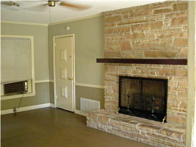 103 Brandywine Road Pensacola, FL 32507 - Photo 11 of 17 VIEW OF FAMILY ROOM WITH FIREPLACE AND DOOR LEADING TO GUEST SUITE BEDROOM
