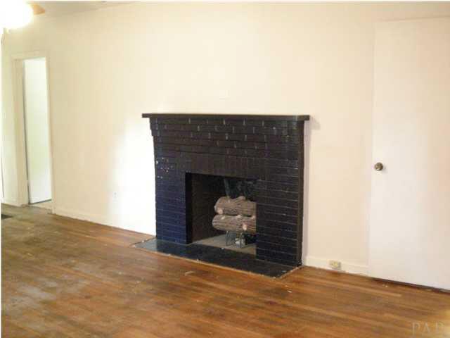103 Brandywine Road Pensacola, FL 32507 - Photo 4 of 17 FORMAL LIVING ROOM FEATURING FIREPLACE AND HARDWOOD FLOORS