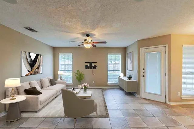 a living room with furniture and a large window