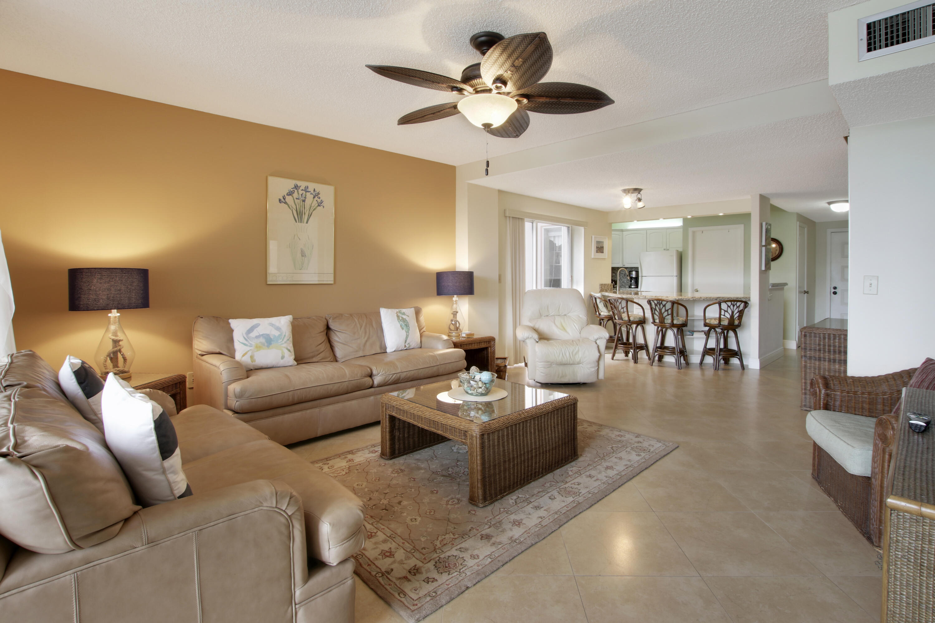 353 Highway 1, Unit C105 Jupiter, FL 33477 - Photo 11 of 33 a living room with furniture kitchen view and a chandelier