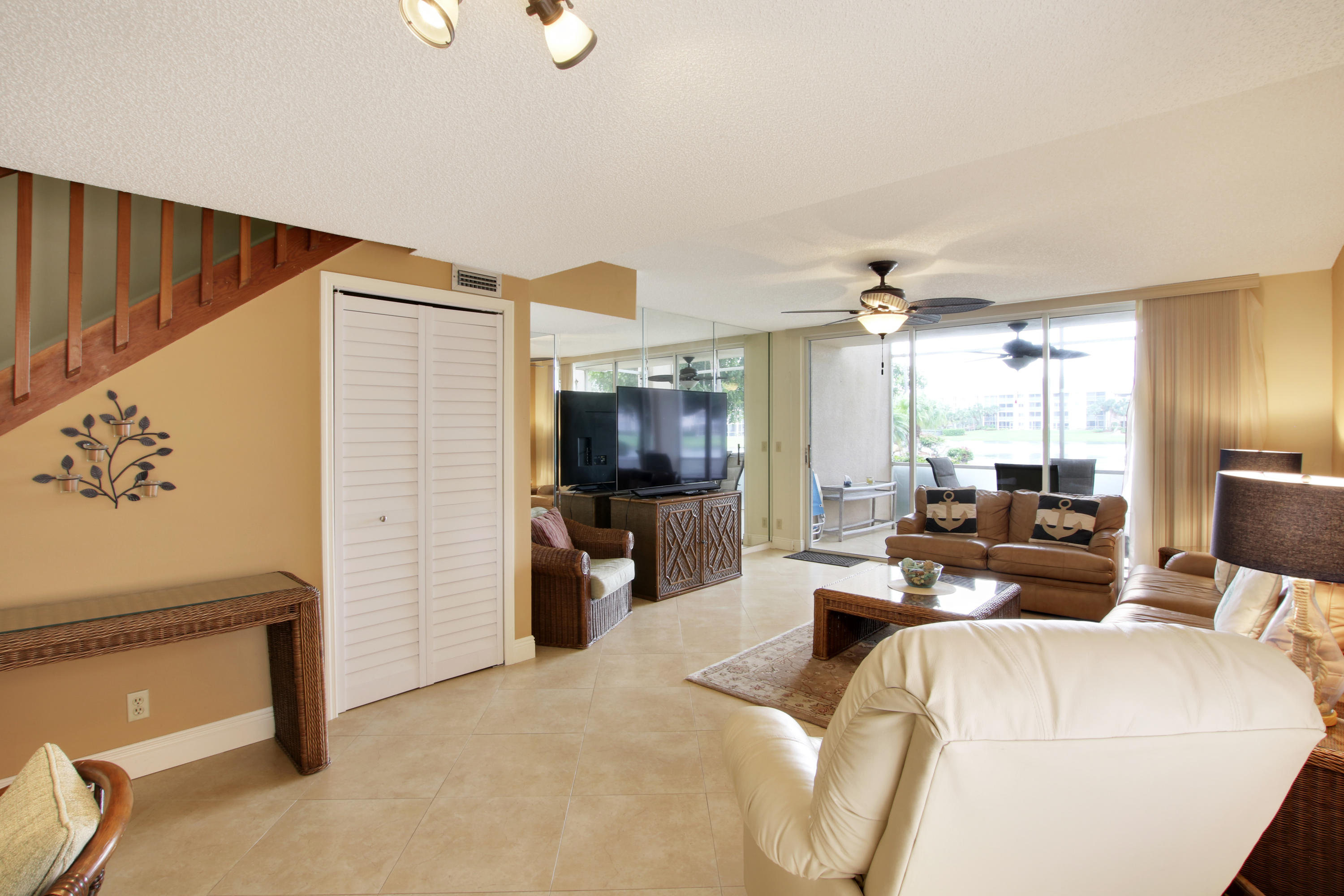353 Highway 1, Unit C105 Jupiter, FL 33477 - Photo 12 of 33 a living room with furniture and a flat screen tv