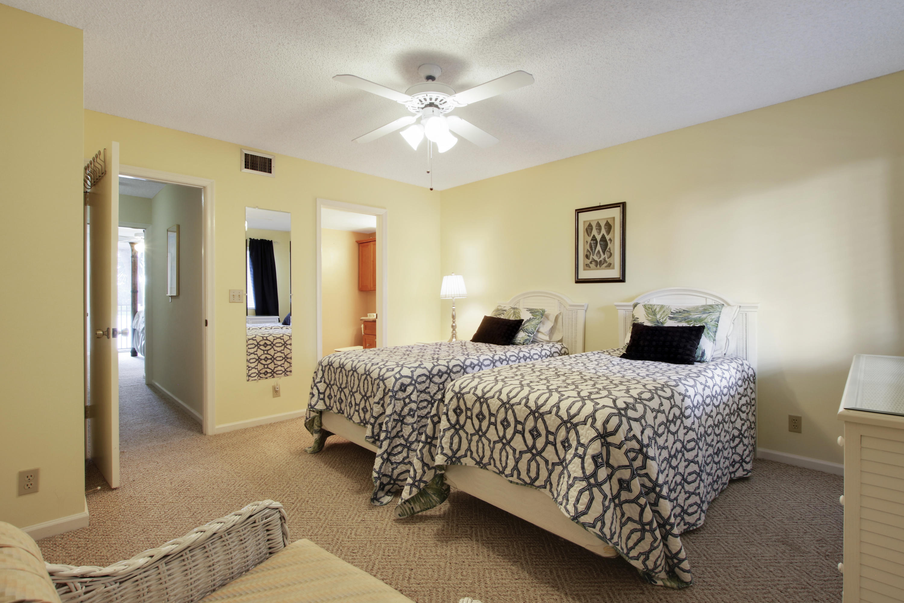 353 Highway 1, Unit C105 Jupiter, FL 33477 - Photo 22 of 33 a bedroom with a bed and ceiling fan