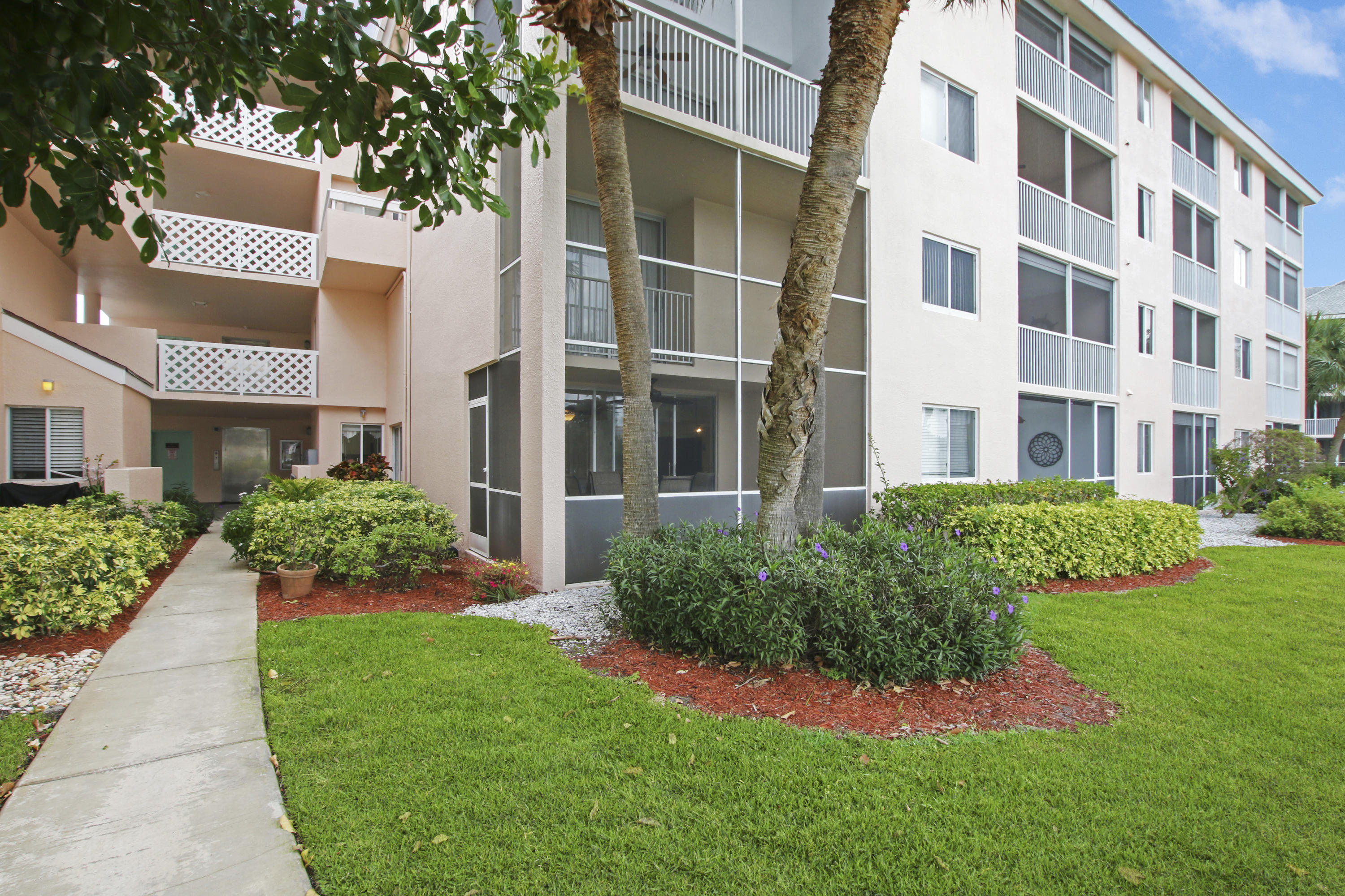 353 Highway 1, Unit C105 Jupiter, FL 33477 - Photo 24 of 33 a view of an apartment with a garden