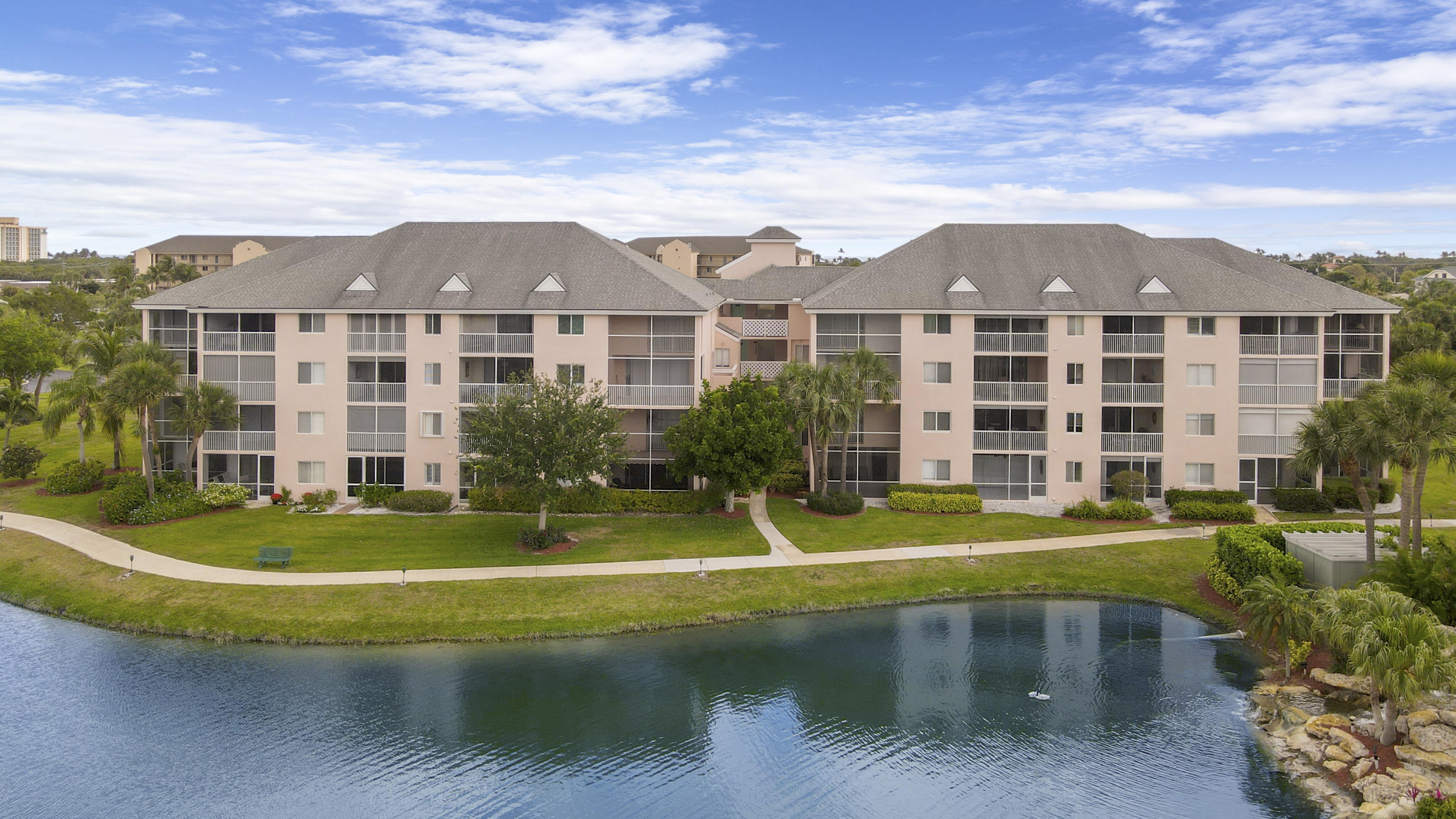 353 Highway 1, Unit C105 Jupiter, FL 33477 - Photo 25 of 33 a front view of a house with a yard
