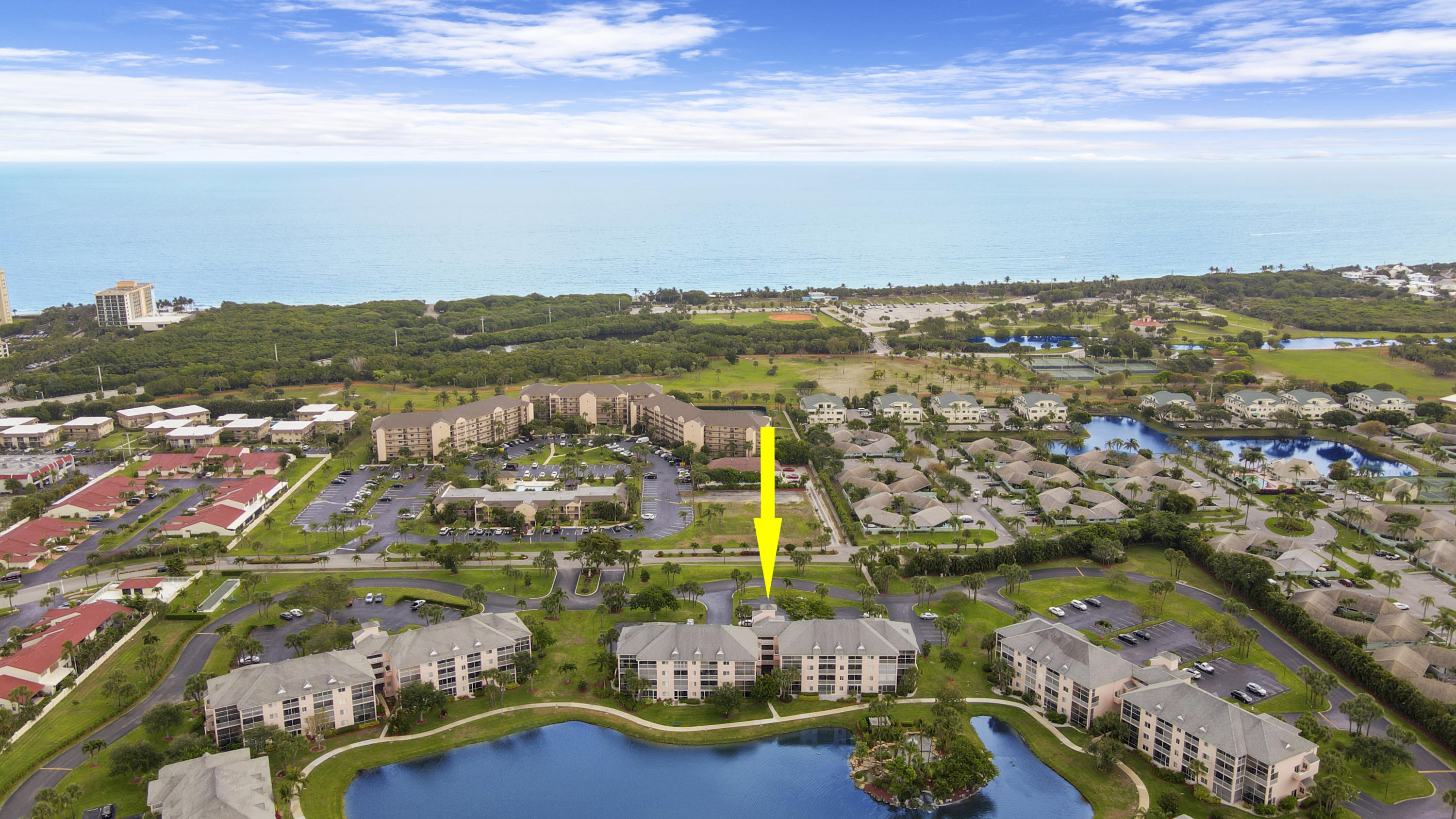 353 Highway 1, Unit C105 Jupiter, FL 33477 - Photo 30 of 33 an aerial view of residential building with outdoor space