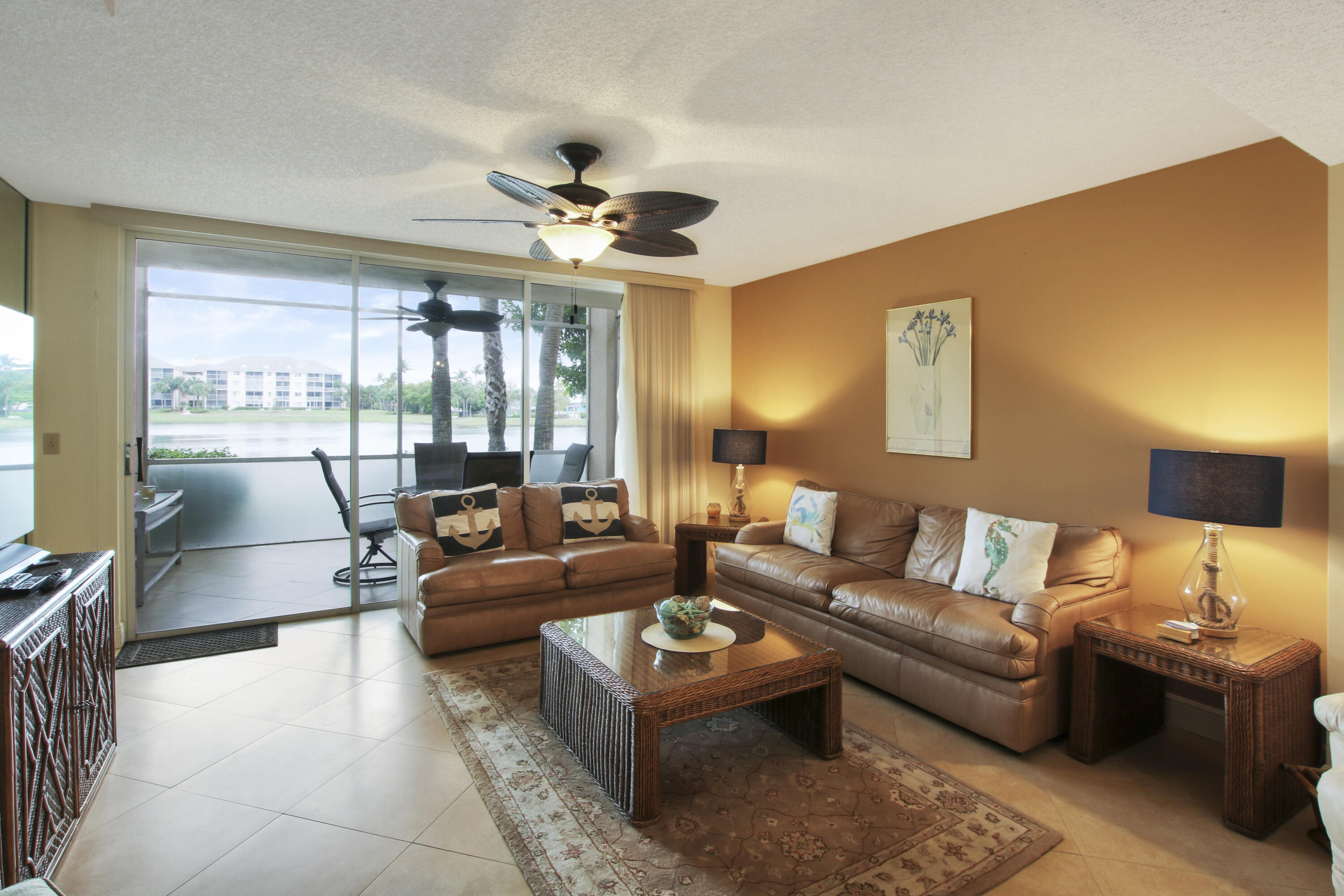 353 Highway 1, Unit C105 Jupiter, FL 33477 - Photo 10 of 33 a living room with furniture and a large window