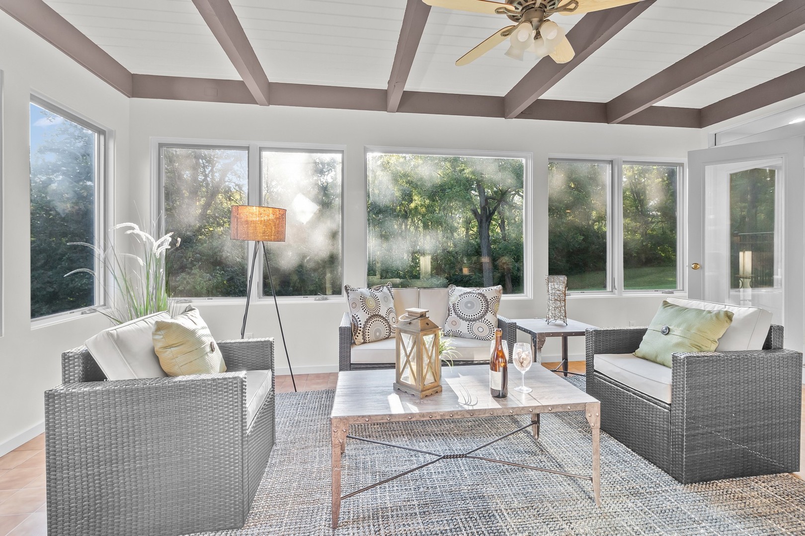 904 North Valley Hill Road Bull Valley, IL 60098 - Photo 12 of 33 a living room with couches and a dining table with garden view