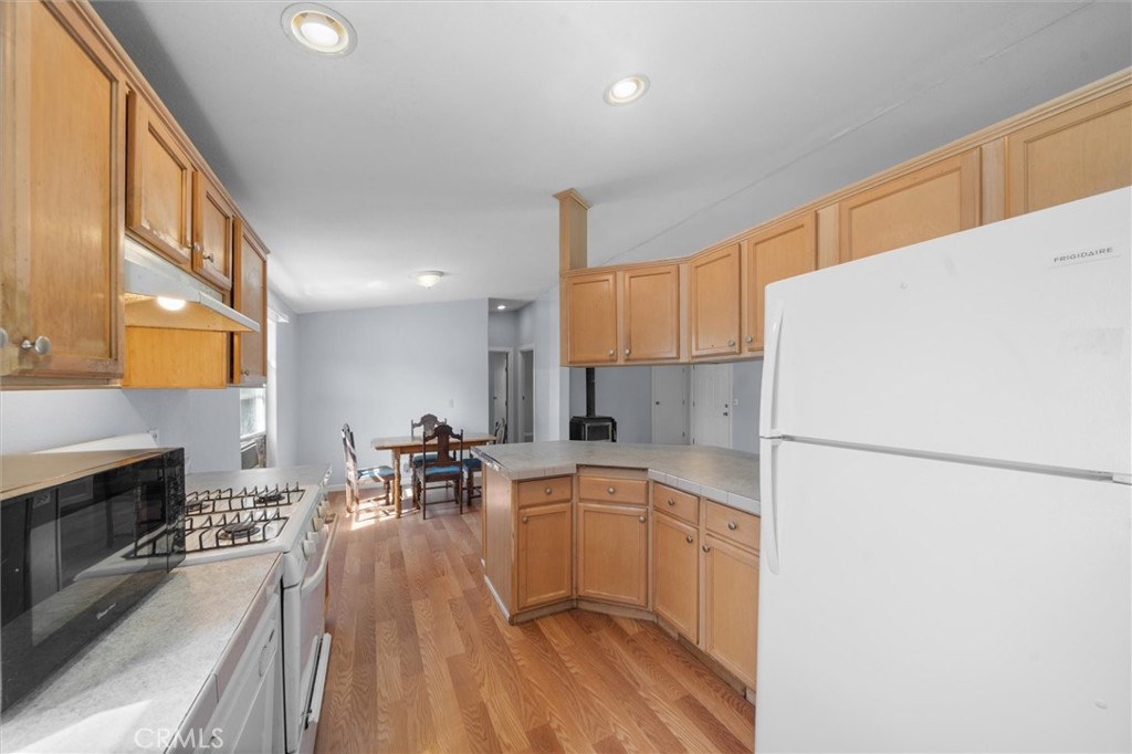 16080 Oakridge Road Corning, CA 96021 - Photo 13 of 39 a kitchen with a sink appliances and cabinets