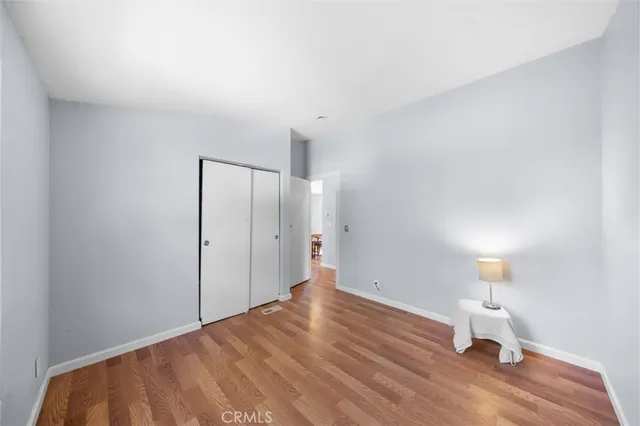 a view of a room with wooden floor