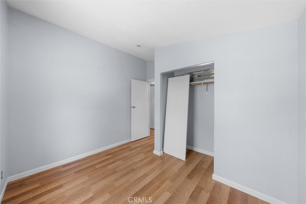 16080 Oakridge Road Corning, CA 96021 - Photo 20 of 39 a view of an empty room with wooden floor and closet