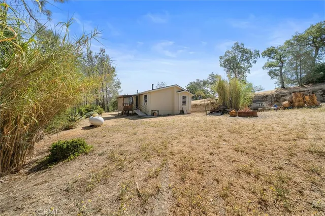 a view of yard covered with snow in front of house