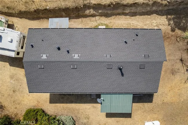 an aerial view of house with yard