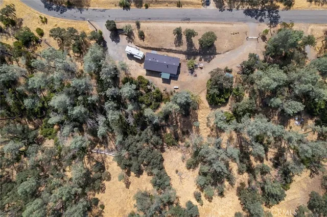an aerial view of a house with yard and outdoor space