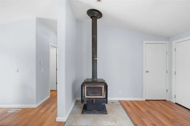 a view of a livingroom with a table and a chair