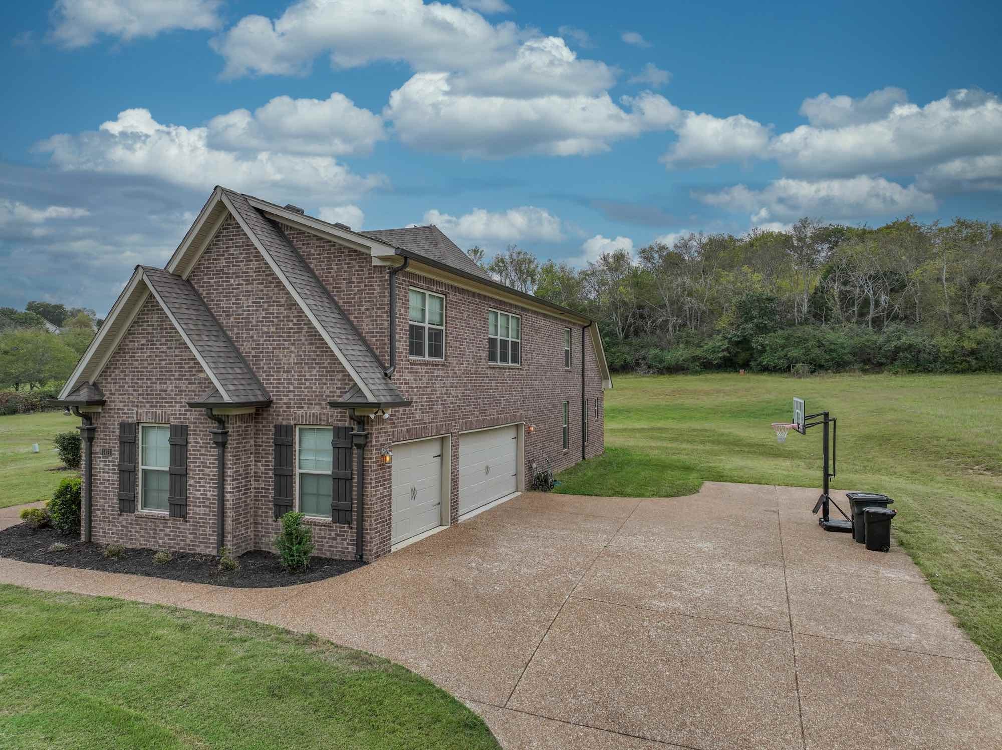 1431 Center Point Road Hendersonville, TN 37075 - Photo 2 of 20 a view of a house with backyard and a garden