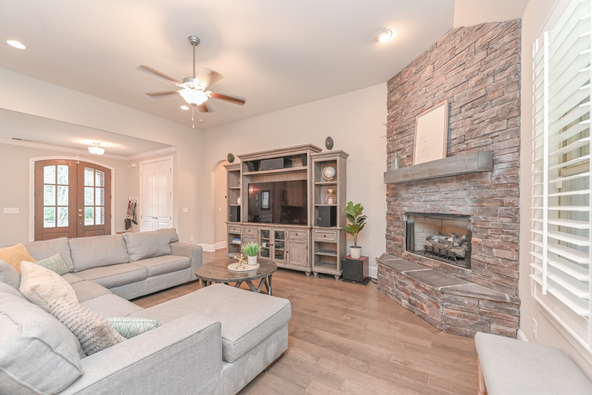 1431 Center Point Road Hendersonville, TN 37075 - Photo 5 of 20 a living room with furniture a fireplace and a flat screen tv