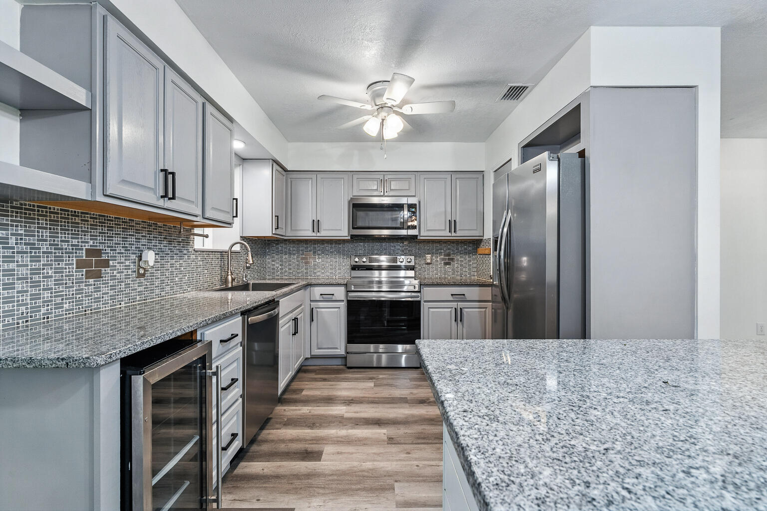 3961 Painter Branch Road Crestview, FL 32539 - Photo 1 of 49 a kitchen with stainless steel appliances granite countertop a stove top oven a sink and dishwasher