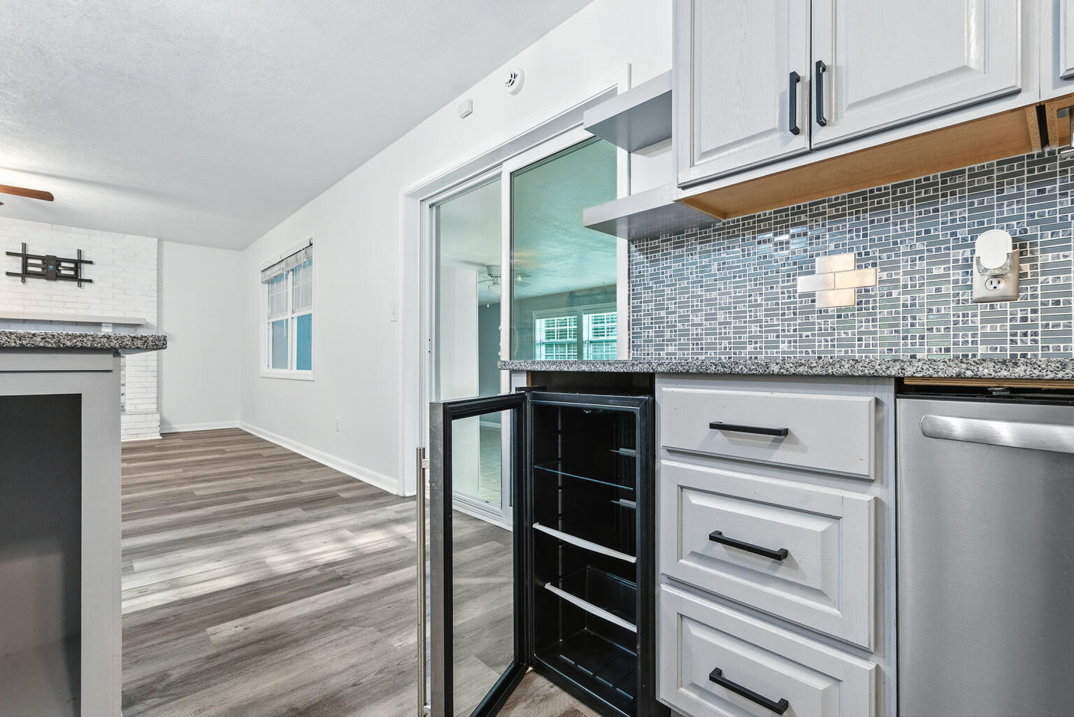 3961 Painter Branch Road Crestview, FL 32539 - Photo 11 of 49 a kitchen with granite countertop a stove and a refrigerator