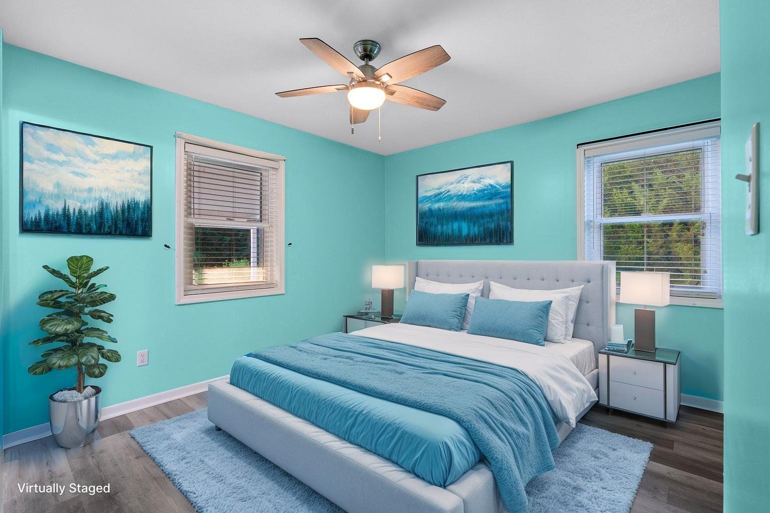 3961 Painter Branch Road Crestview, FL 32539 - Photo 12 of 49 a bedroom with a large bed plant and a window