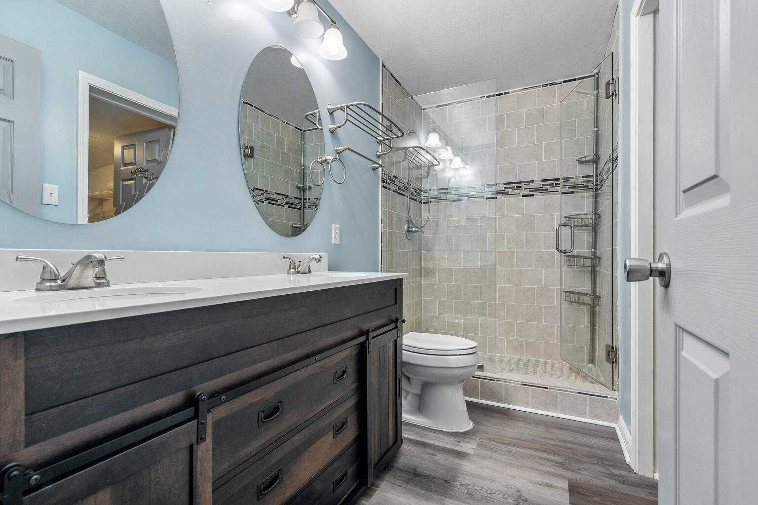 3961 Painter Branch Road Crestview, FL 32539 - Photo 15 of 49 a bathroom with a double vanity sink toilet and shower
