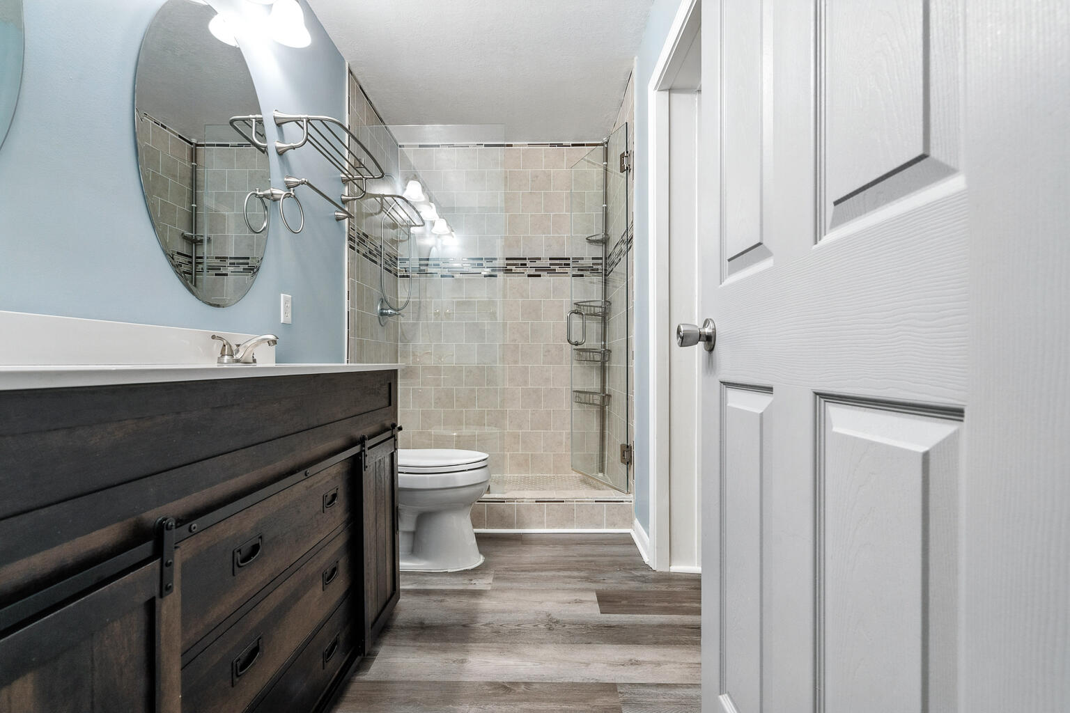 3961 Painter Branch Road Crestview, FL 32539 - Photo 27 of 49 a bathroom with a granite countertop sink toilet and shower