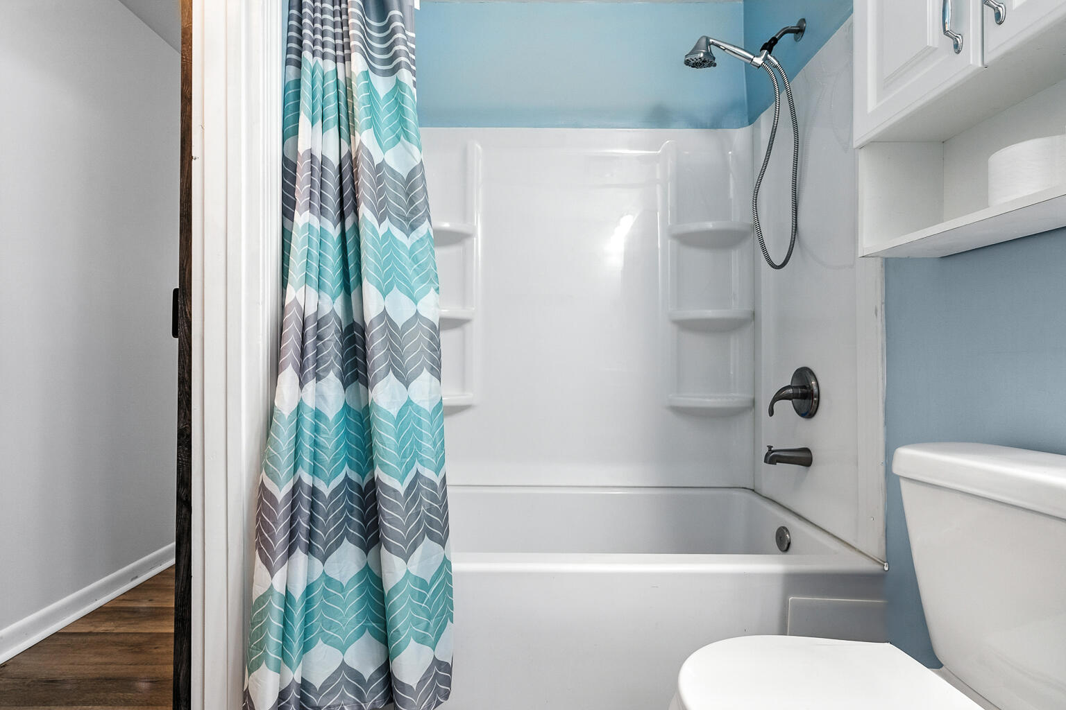 3961 Painter Branch Road Crestview, FL 32539 - Photo 29 of 49 a white toilet sitting next to a bath tub