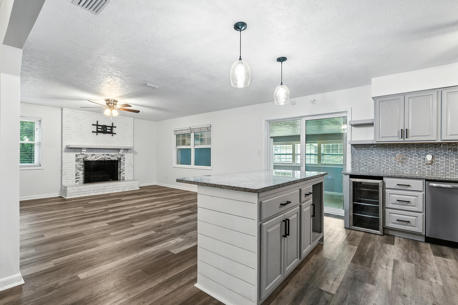 3961 Painter Branch Road Crestview, FL 32539 - Photo 36 of 49 a kitchen with a stove oven and a fireplace