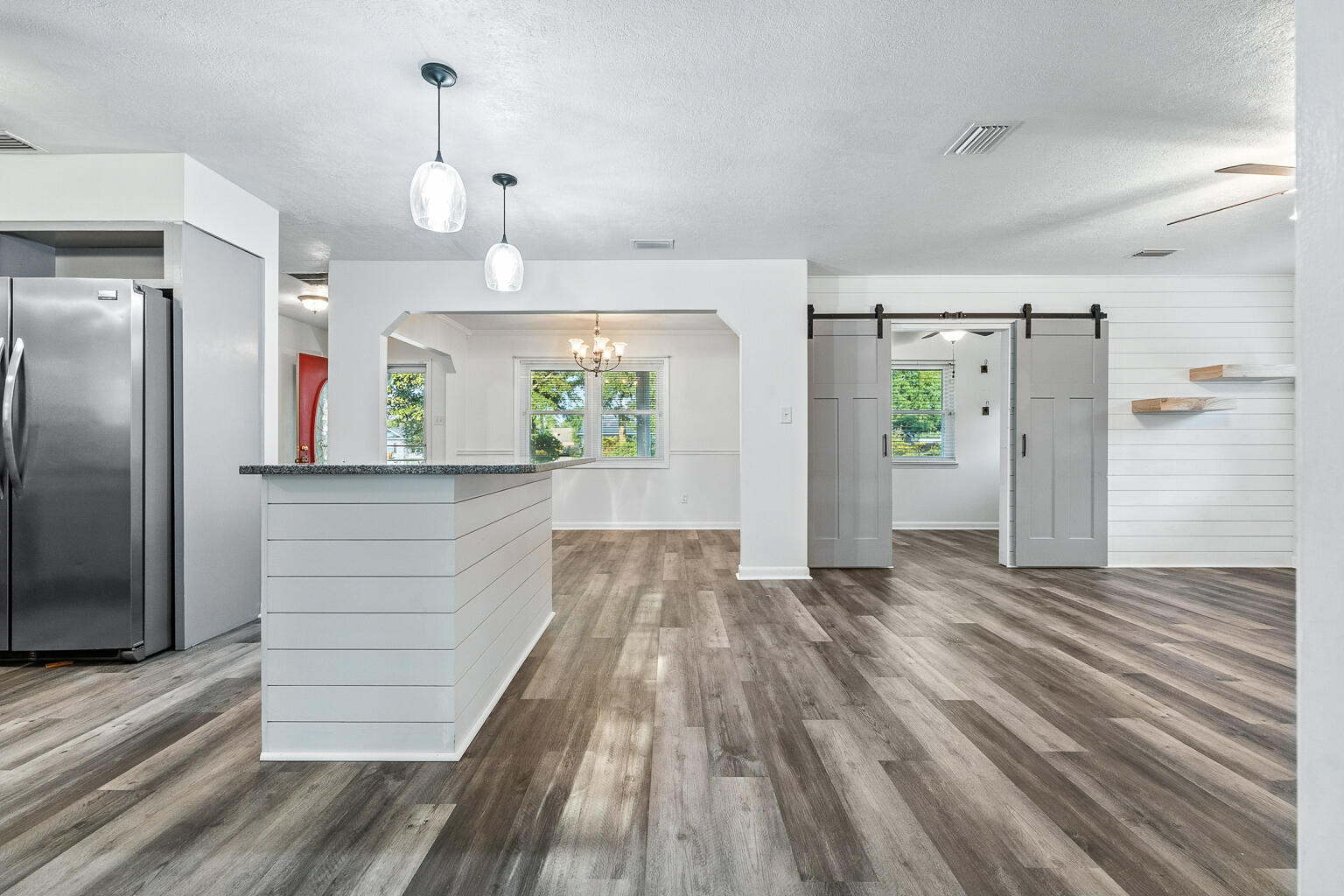 3961 Painter Branch Road Crestview, FL 32539 - Photo 42 of 49 wooden floor in an empty room and a window