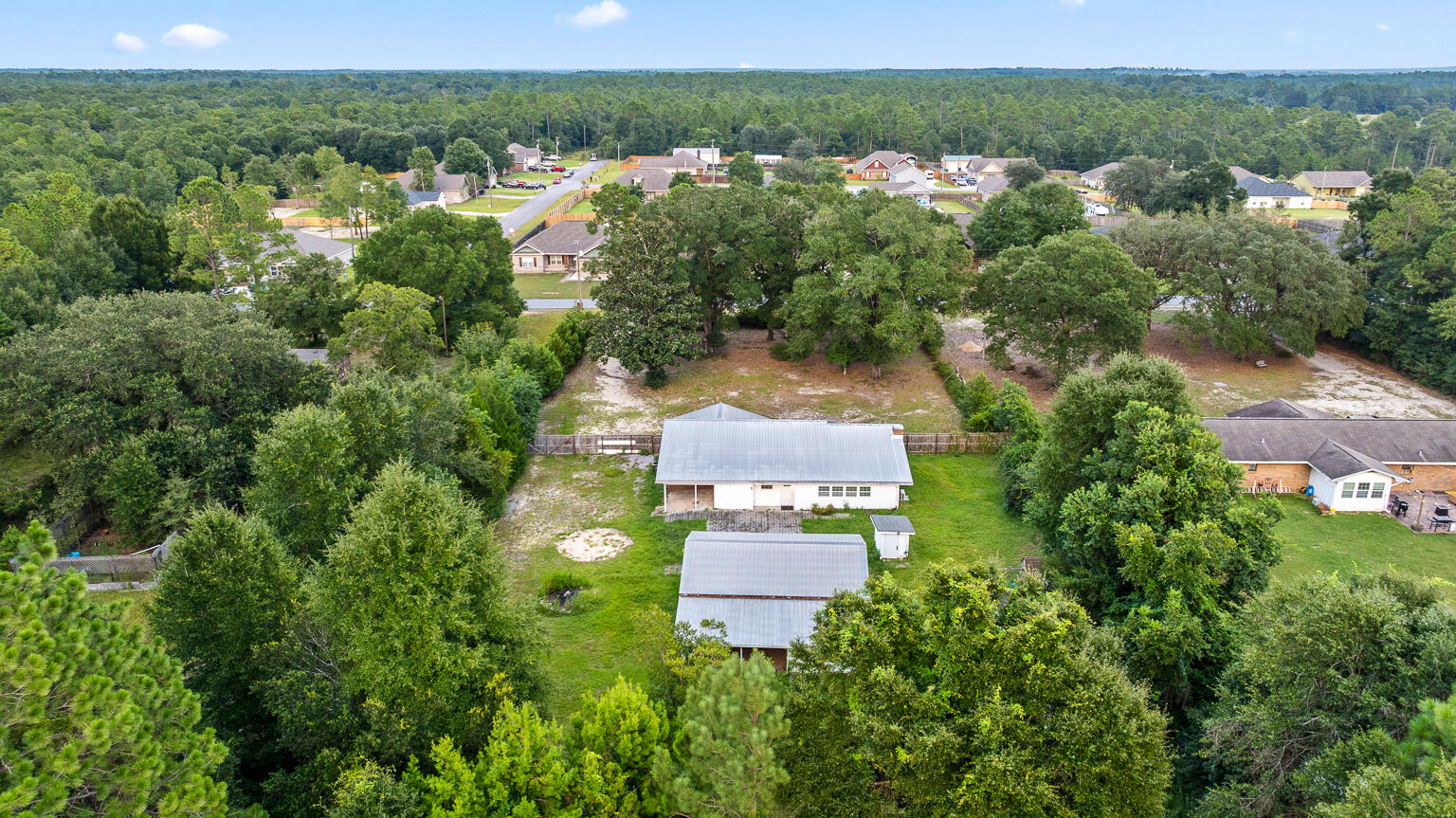 3961 Painter Branch Road Crestview, FL 32539 - Photo 45 of 49 an aerial view of a house with a yard