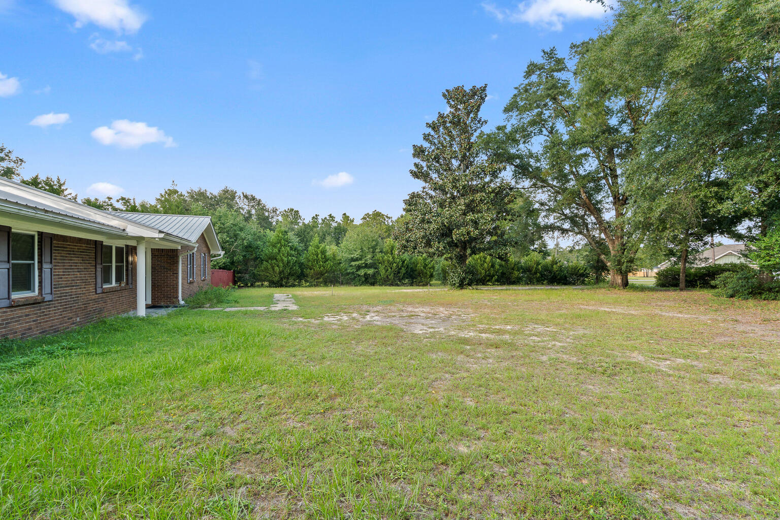 3961 Painter Branch Road Crestview, FL 32539 - Photo 49 of 49 a view of a house with backyard and garden