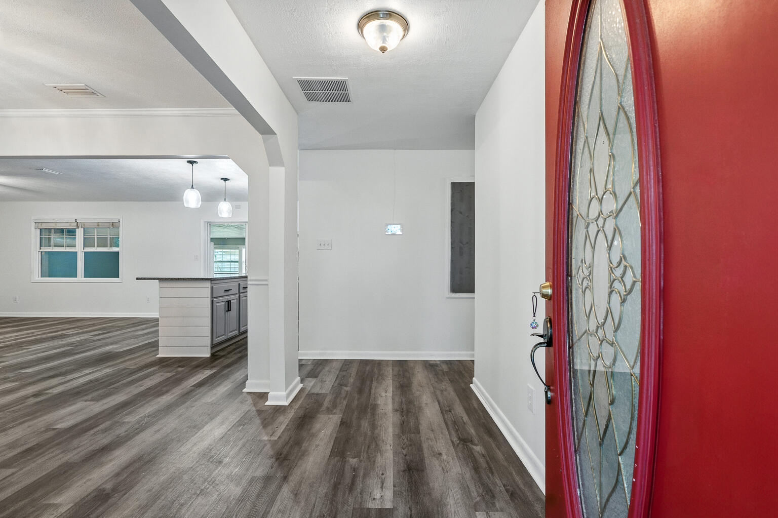 3961 Painter Branch Road Crestview, FL 32539 - Photo 7 of 49 a view of a bedroom with wooden floor and kitchen