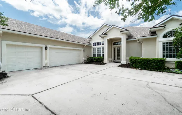 a view of a white house with a outdoor space