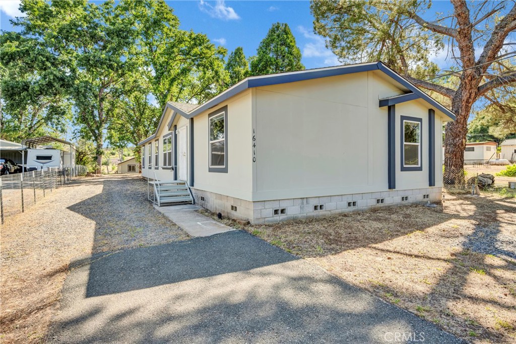 16410 Tish-A-Tang Road Lower Lake, CA 95457 - Photo 2 of 48 a view of a house with a backyard