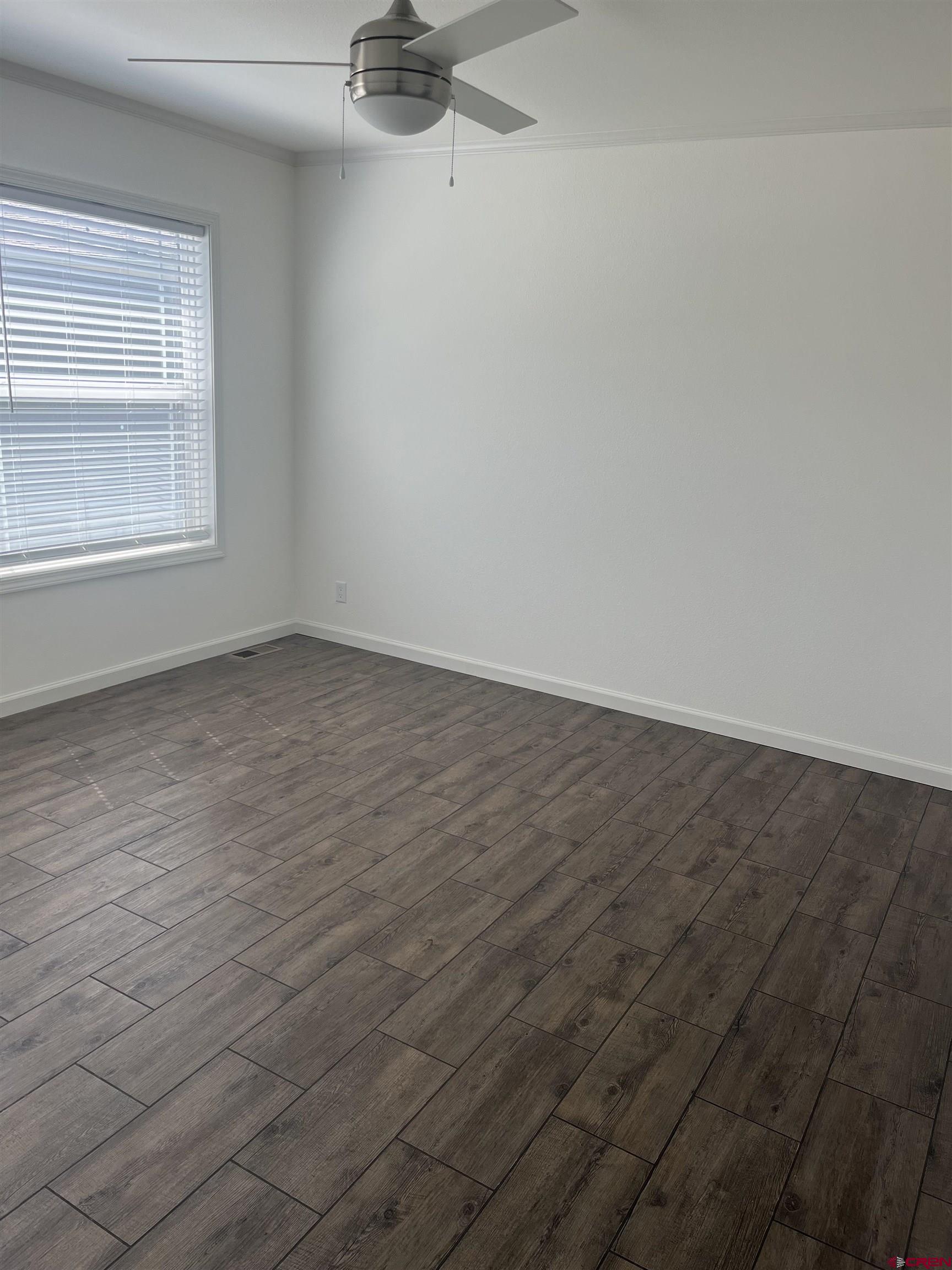 901 6530 Road, Unit 1414 Montrose, CO 81401 - Photo 8 of 16 an empty room with a window