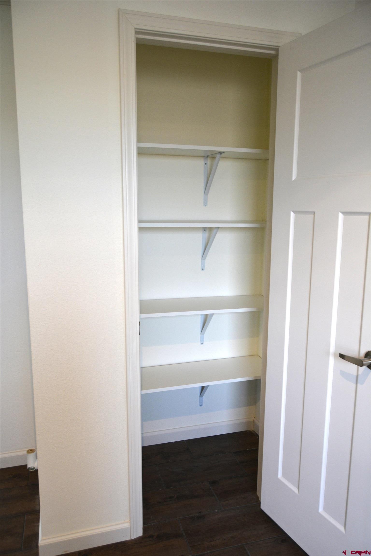 901 6530 Road, Unit 1414 Montrose, CO 81401 - Photo 10 of 16 a view of walk in closet with empty racks
