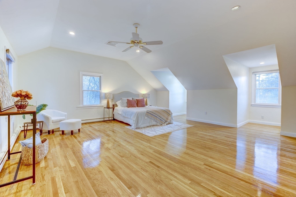 17 Bridle Path Walpole, MA 02081 - Photo 24 of 38 a bedroom with a bed and wooden floor