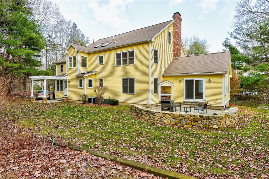 17 Bridle Path Walpole, MA 02081 - Photo 30 of 38 front view of a house with a yard