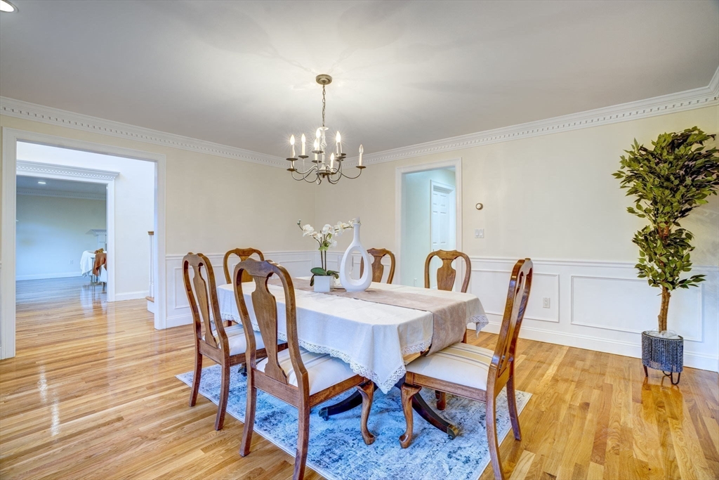 17 Bridle Path Walpole, MA 02081 - Photo 10 of 38 a view of a dining room with furniture and wooden floor