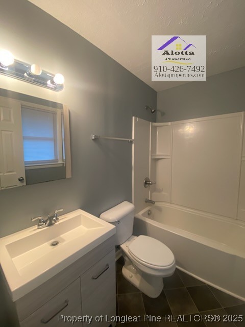 6527 Tareyton Road Fayetteville, NC 28314 - Photo 11 of 11 a bathroom with a sink a toilet and shower