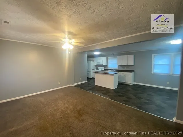 a view of a kitchen with a sink cabinets and a window