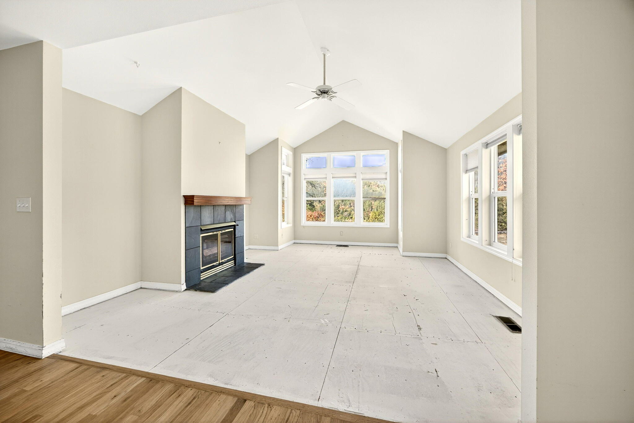 2467 Eastside Road Jacksonville, OR 97530 - Photo 48 of 85 an empty room with windows and fireplace