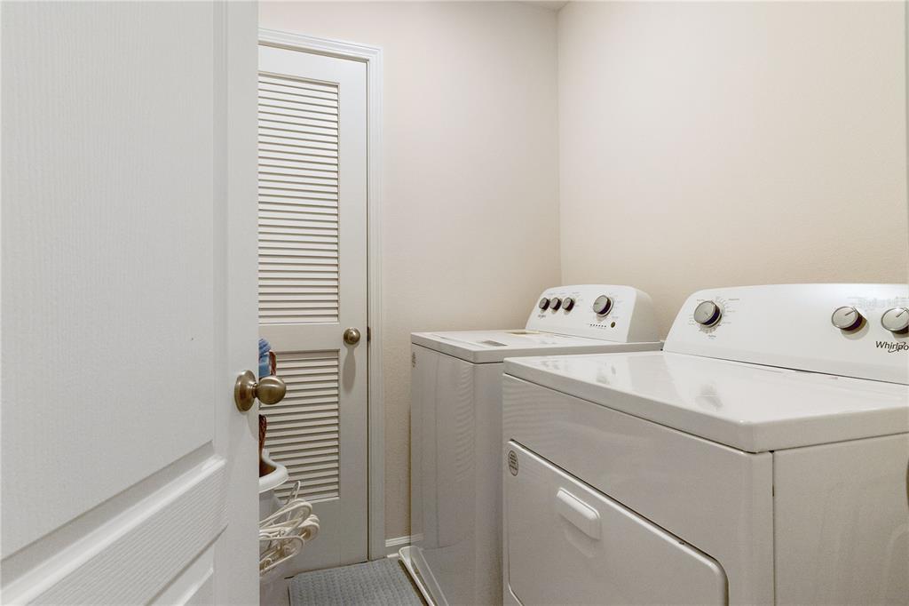 117 Redbud Road Palm Coast, FL 32137 - Photo 13 of 13 a utility room with dryer and washer